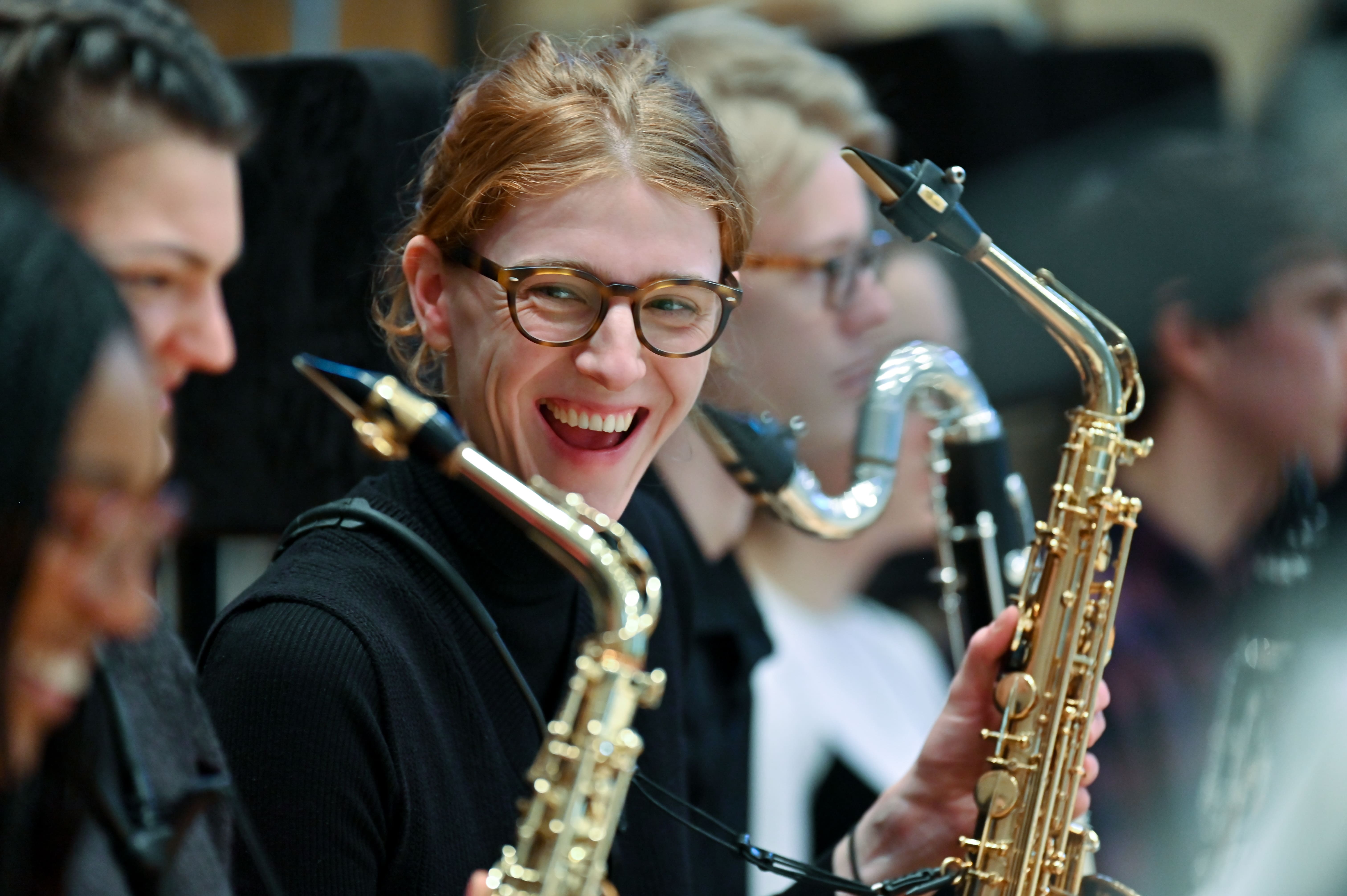 Smiling female student with a saxophone test